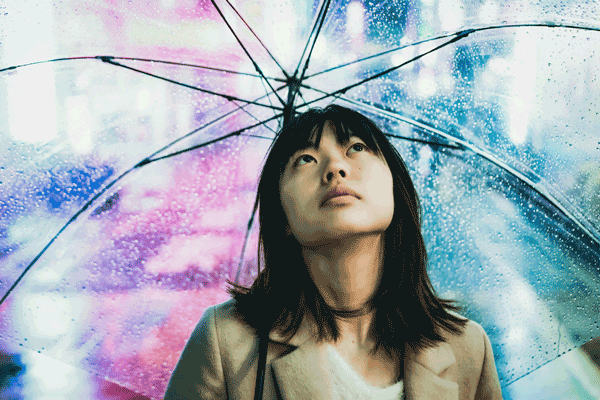 Generation Z Asian girl under umbrella